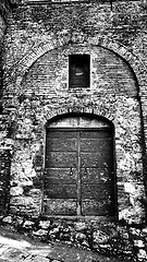 Image showing Wooden door in Tuscany, Italy in black and white