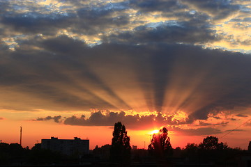 Image showing Dark sunset above the multistory house