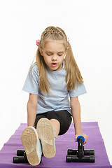 Image showing Girl athlete is engaged with stops for push-ups