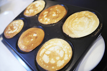 Image showing breakfast with six pancakes on electric oven