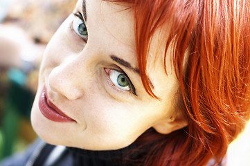 Image showing a young happy red-haired women