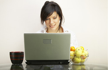 Image showing beautiful woman with laptop chair over white