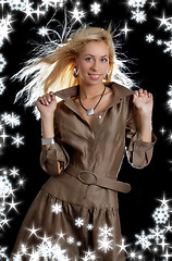 Image showing dancing blond in brown dress with snowflakes
