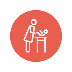 Image showing Woman changing the diaper thin line icon