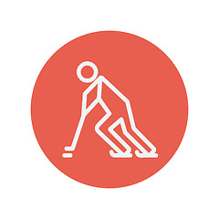 Image showing Hockey player pushing the puck thin line icon
