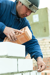 Image showing Bricklayer works on house construction