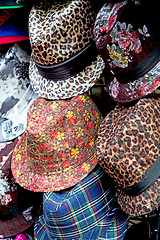 Image showing in london old red hat and black  the  fashion shop