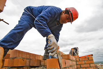 Image showing Bricklayer on house construction