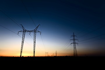 Image showing Large transmission towers at blue hour 