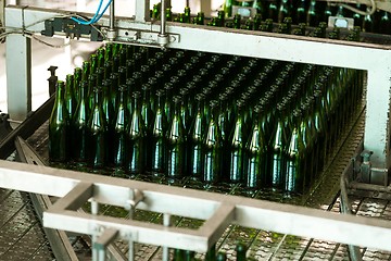 Image showing Many bottles on conveyor belt