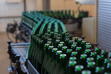 Image showing Many bottles on conveyor belt