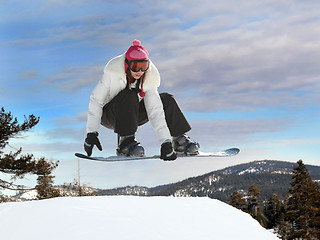 Image showing Girl snowboarding