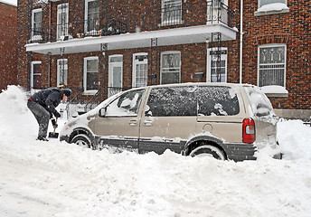Image showing Man shovelling after a snow storm