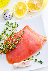 Image showing Raw salmon on the white plate with thyme and salt