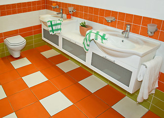 Image showing Orange faucets