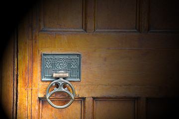 Image showing handle in london antique brown door  rusty  brass nail and light