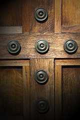 Image showing in london antique brown door  rusty  brass nail and light