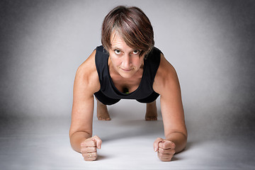 Image showing Middle aged woman forearm push-ups