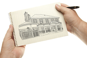 Image showing Hands Holding Pen and Pad of Paper with House Drawing