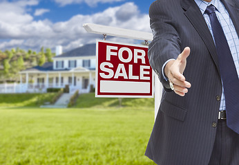 Image showing Agent Reaches for Handshake, Sale Sign and House Behind