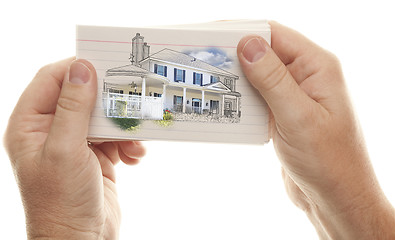 Image showing Male Hands Holding Stack of Flash Cards with House Drawing