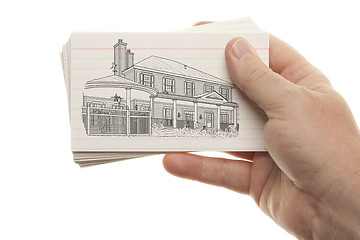 Image showing Male Hand Holding Stack of Flash Cards with House Drawing