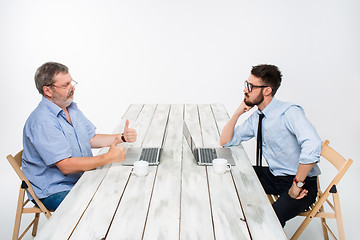 Image showing The two colleagues working on project together