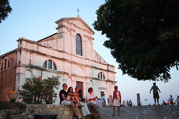 Image showing Tourists sightseeing Saint Eufemia church