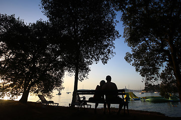 Image showing Couple sitting on bench 