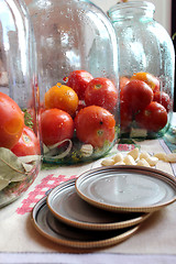 Image showing tomatos in jars prepared for preservation