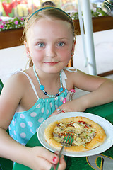Image showing girl eating pizza