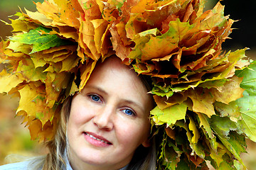 Image showing woman with yellow leaves on the head