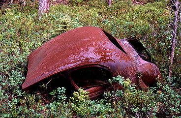 Image showing Old rusty car in disintegration.