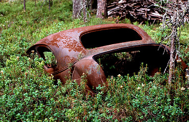 Image showing Old rusty car in disintegration.