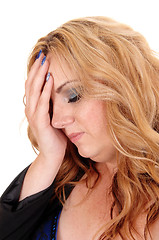 Image showing Blond woman holding her head.