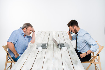 Image showing The two colleagues working together  at office on gray background