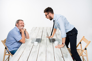 Image showing The two colleagues working together  at office on gray background