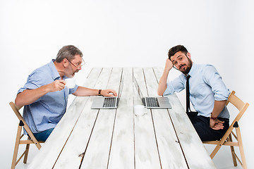 Image showing The two colleagues working together  at office on gray background