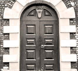 Image showing wooden parliament in london old church door and marble antique  