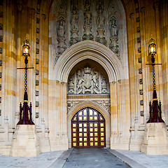 Image showing parliament in london old church door and marble antique  wall
