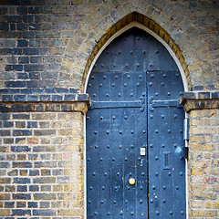 Image showing wooden parliament in london old church door and marble antique  