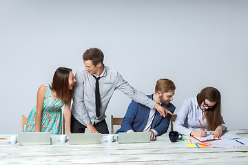 Image showing Business team working on their business project together at office