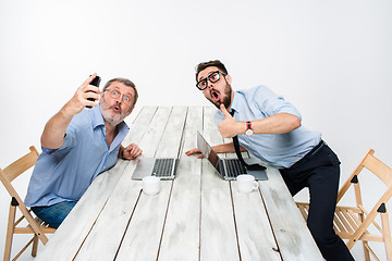 Image showing Two colleagues  taking the picture to them self sitting in office