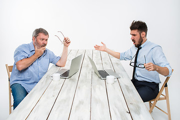 Image showing The two colleagues working together at office on white background