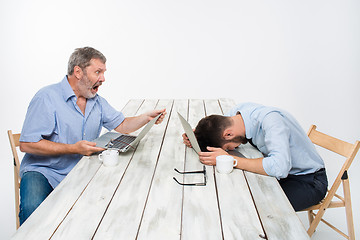 Image showing The two colleagues working together at office on white background