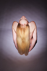 Image showing High Angle View of a Seated Bare Blond Young Woman