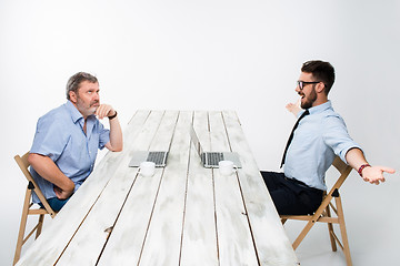 Image showing The two colleagues working together at office on white background