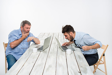 Image showing The two colleagues working together at office on white background