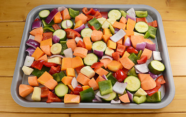 Image showing Chopped raw vegetables seasoned and drizzled with oil