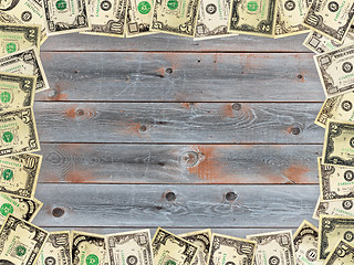 Image showing Frame from the dollars on the wooden board